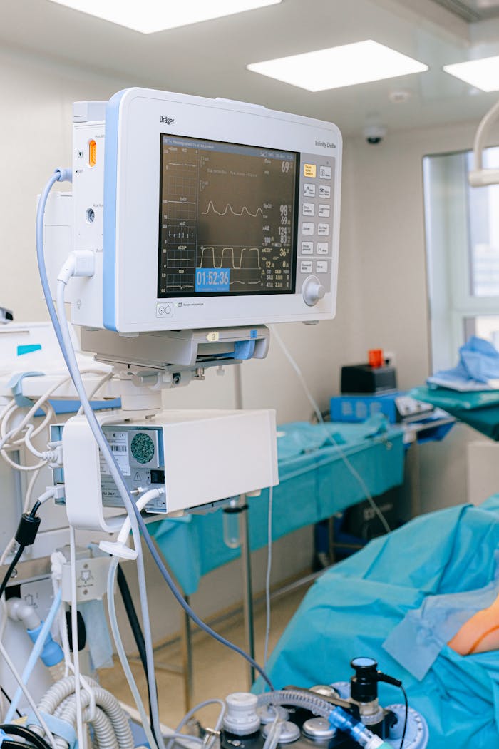 digital Close-up of vital signs monitor in a modern operating room setup.